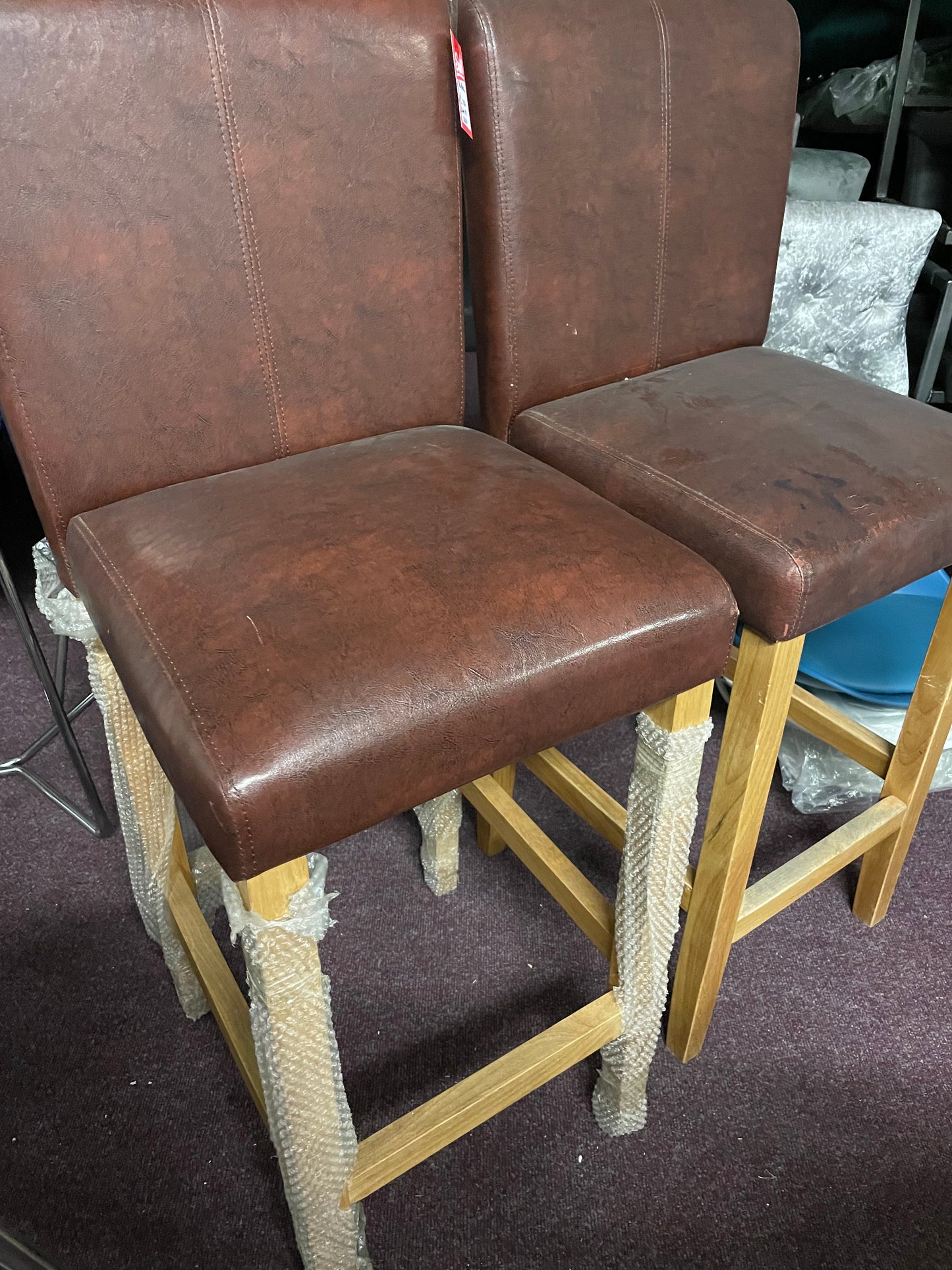 2 leather and oak colour bar stools Ex display unwrapped so for collection only. Pay Instore after viewing