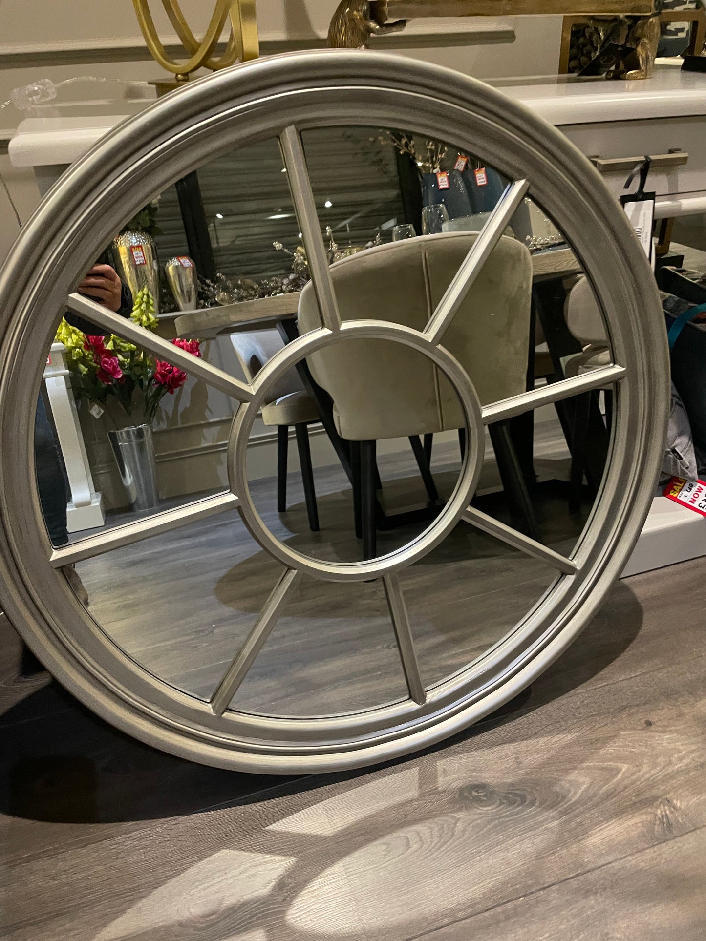 Antiqued Silver round Window mirror.