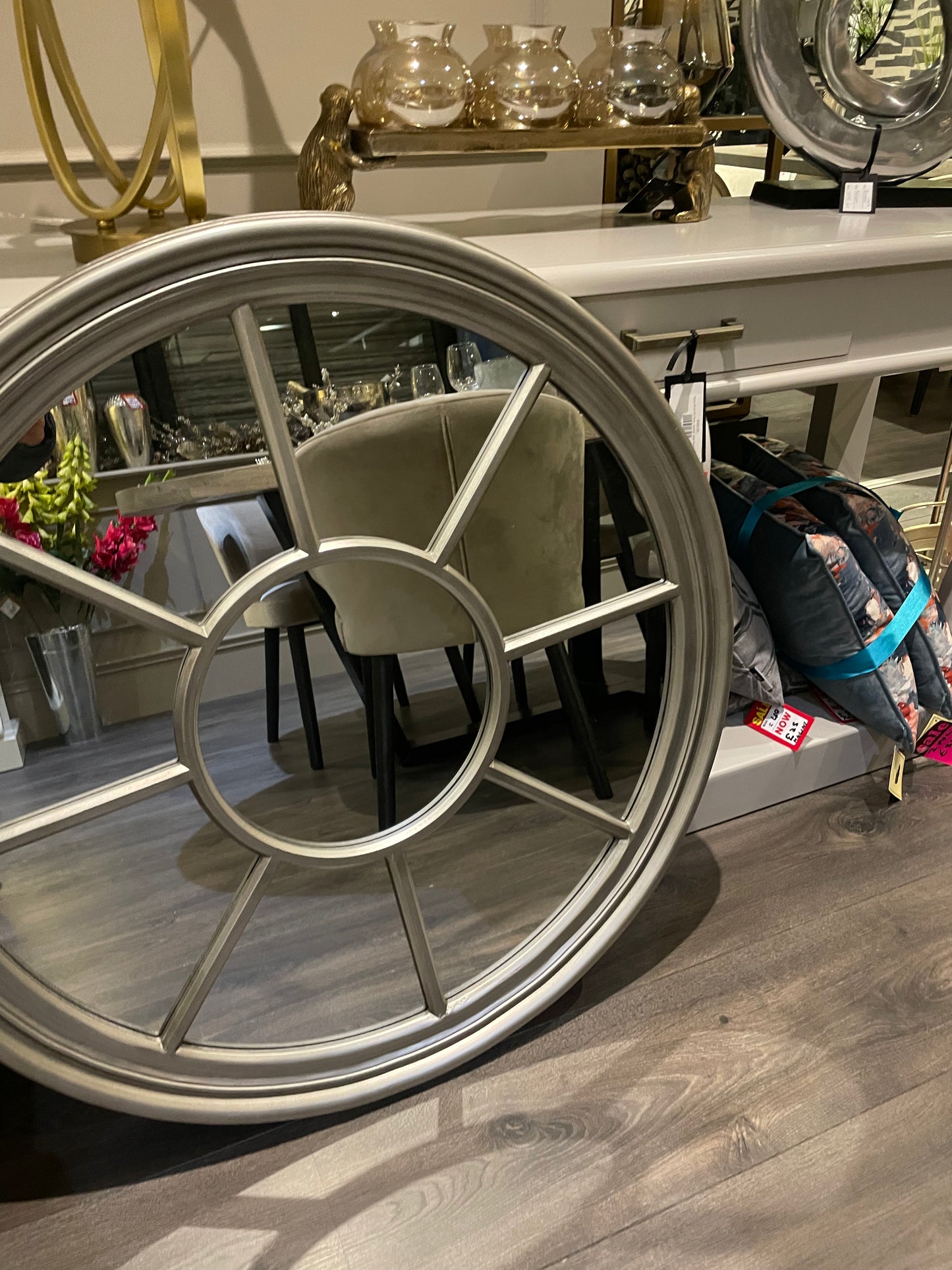 Antiqued Silver round Window mirror.