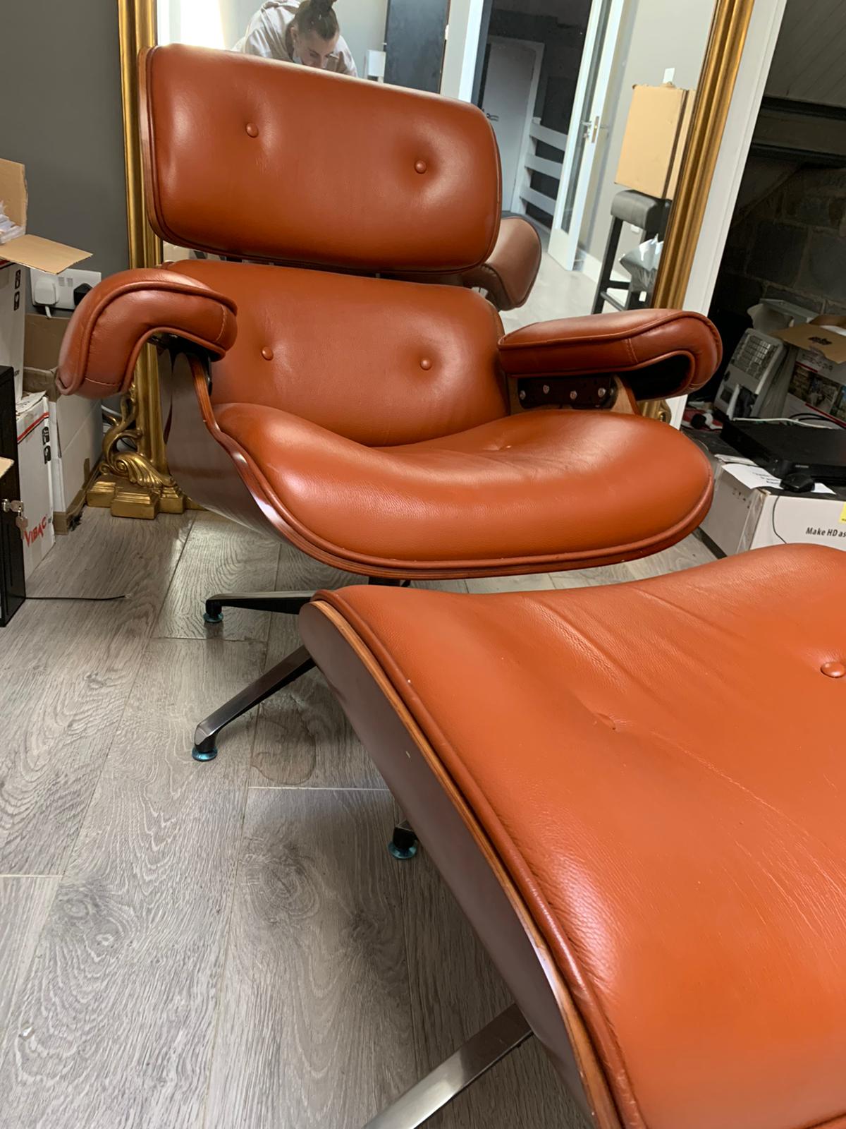 Eames Tan leather chair plus footstool warehouse clearance sold as seen pay Instore only
