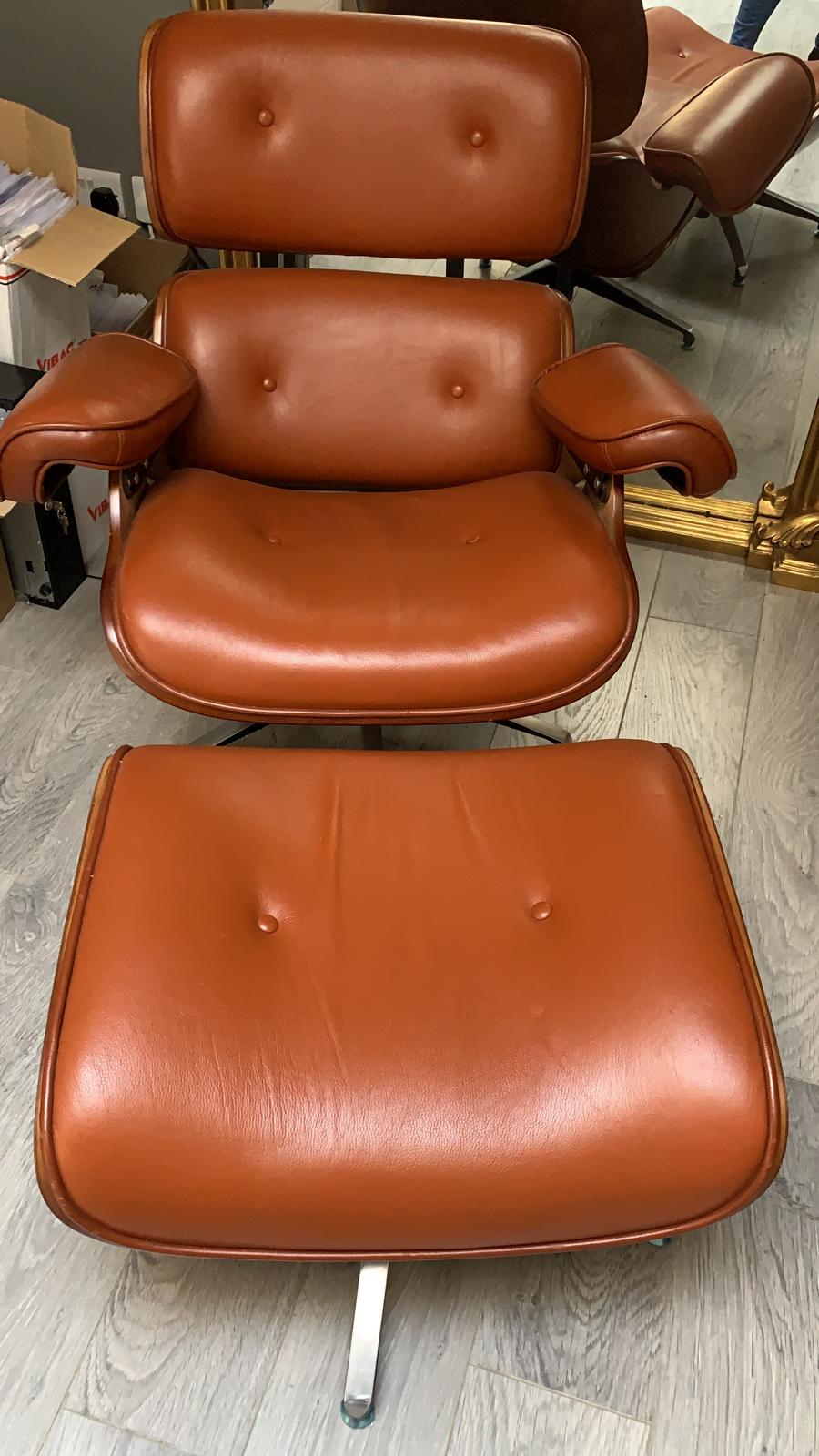 Eames Tan leather chair plus footstool warehouse clearance sold as seen pay Instore only