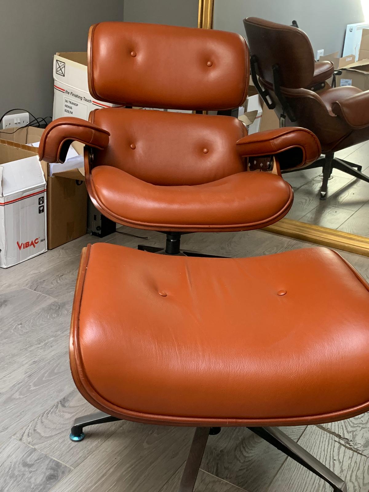 Eames Tan leather chair plus footstool warehouse clearance sold as seen pay Instore only