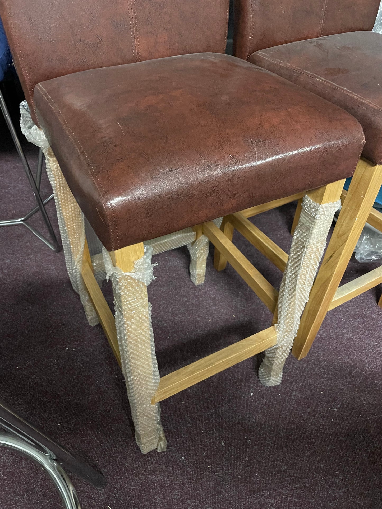 2 leather and oak colour bar stools Ex display  unwrapped so for collection only