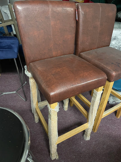 2 leather and oak colour bar stools Ex display  unwrapped so for collection only. Pay Instore after viewing