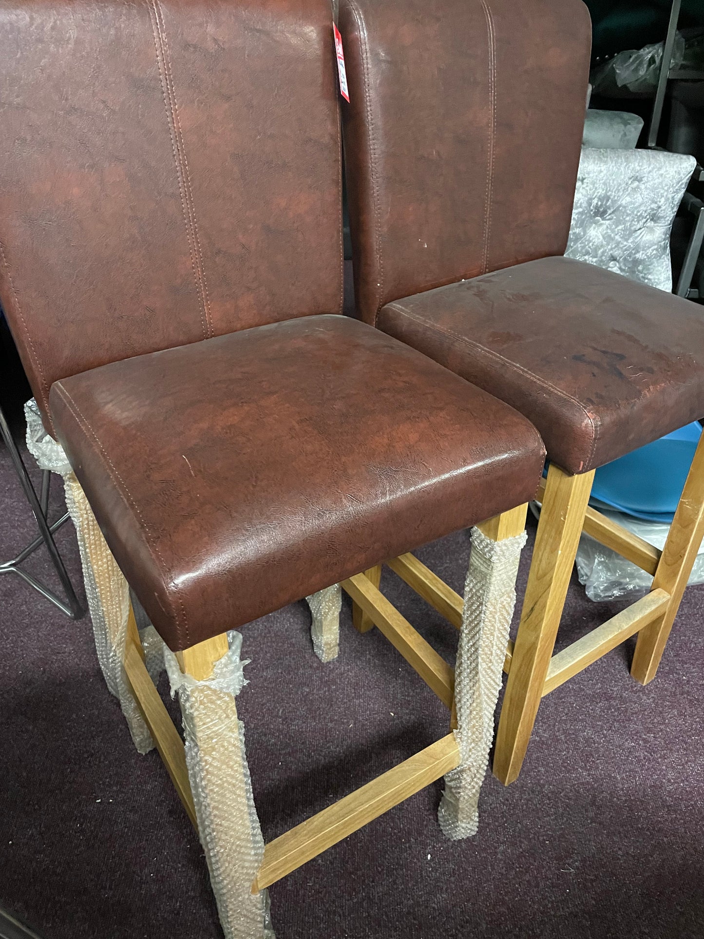 2 leather and oak colour bar stools Ex display  unwrapped so for collection only