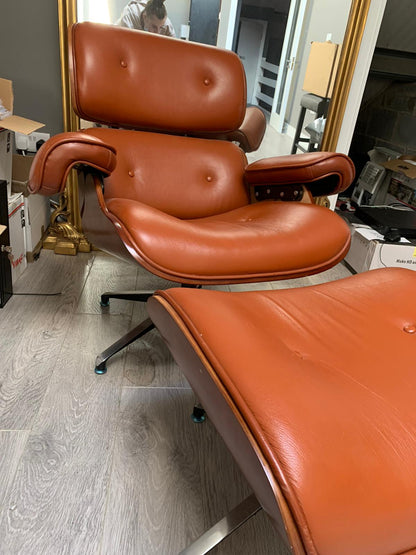 Eames Tan leather chair plus footstool warehouse clearance sold as seen pay Instore only