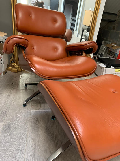 Eames Tan leather chair plus footstool warehouse clearance sold as seen pay Instore only